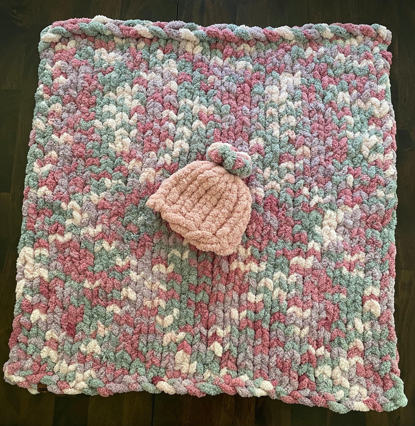 Handmade blanket made with love of 100% soft and cozy polyester chunky chenille yarn, a gift for a cute baby.