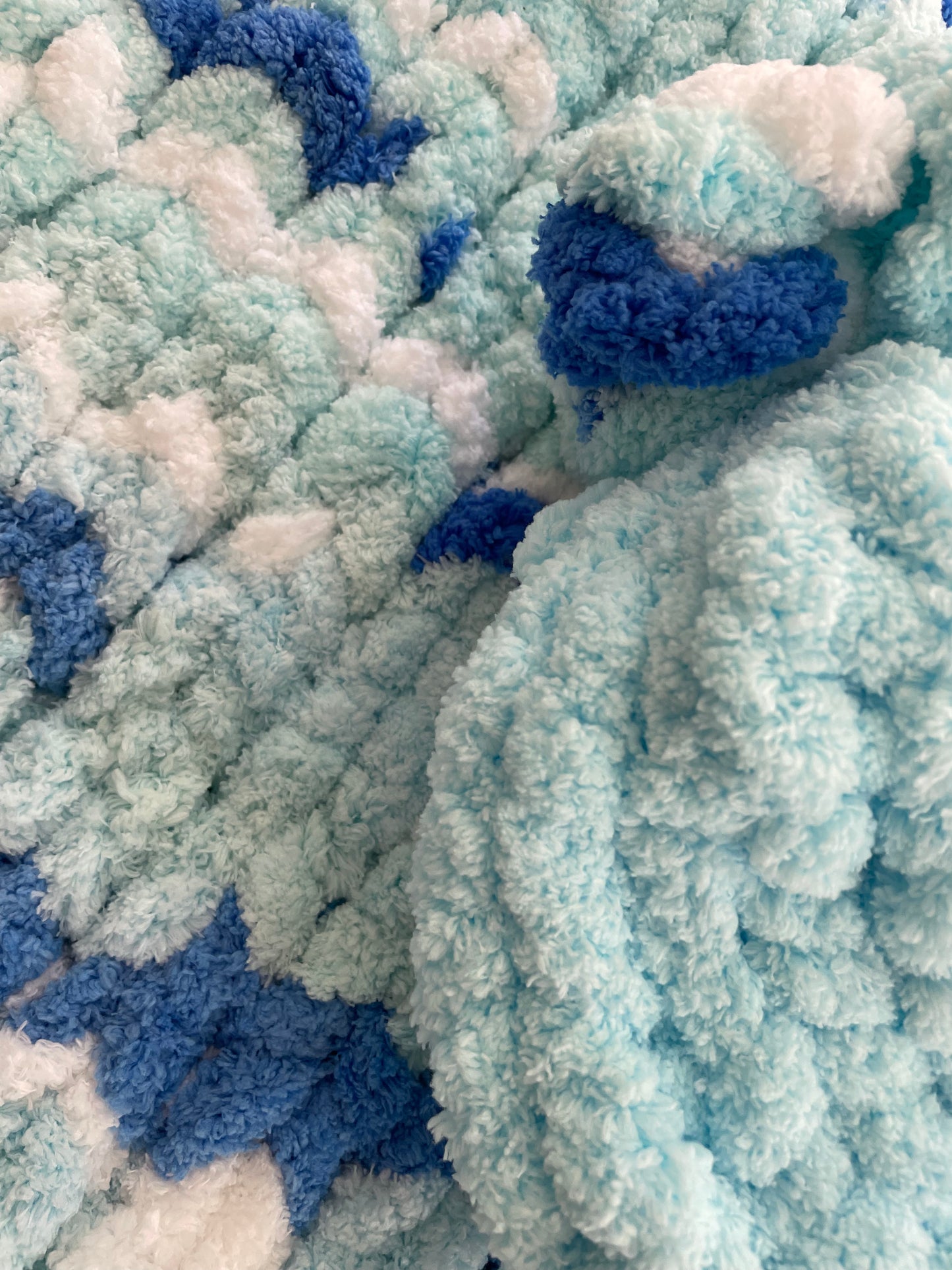 Handmade blanket made with love of 100% soft and cozy polyester chunky chenille yarn, a gift for a cute baby.