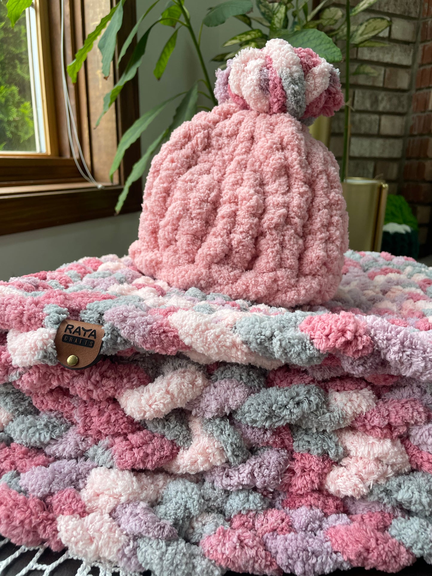 Handmade blanket made with love of 100% soft and cozy polyester chunky chenille yarn, a gift for a cute baby.