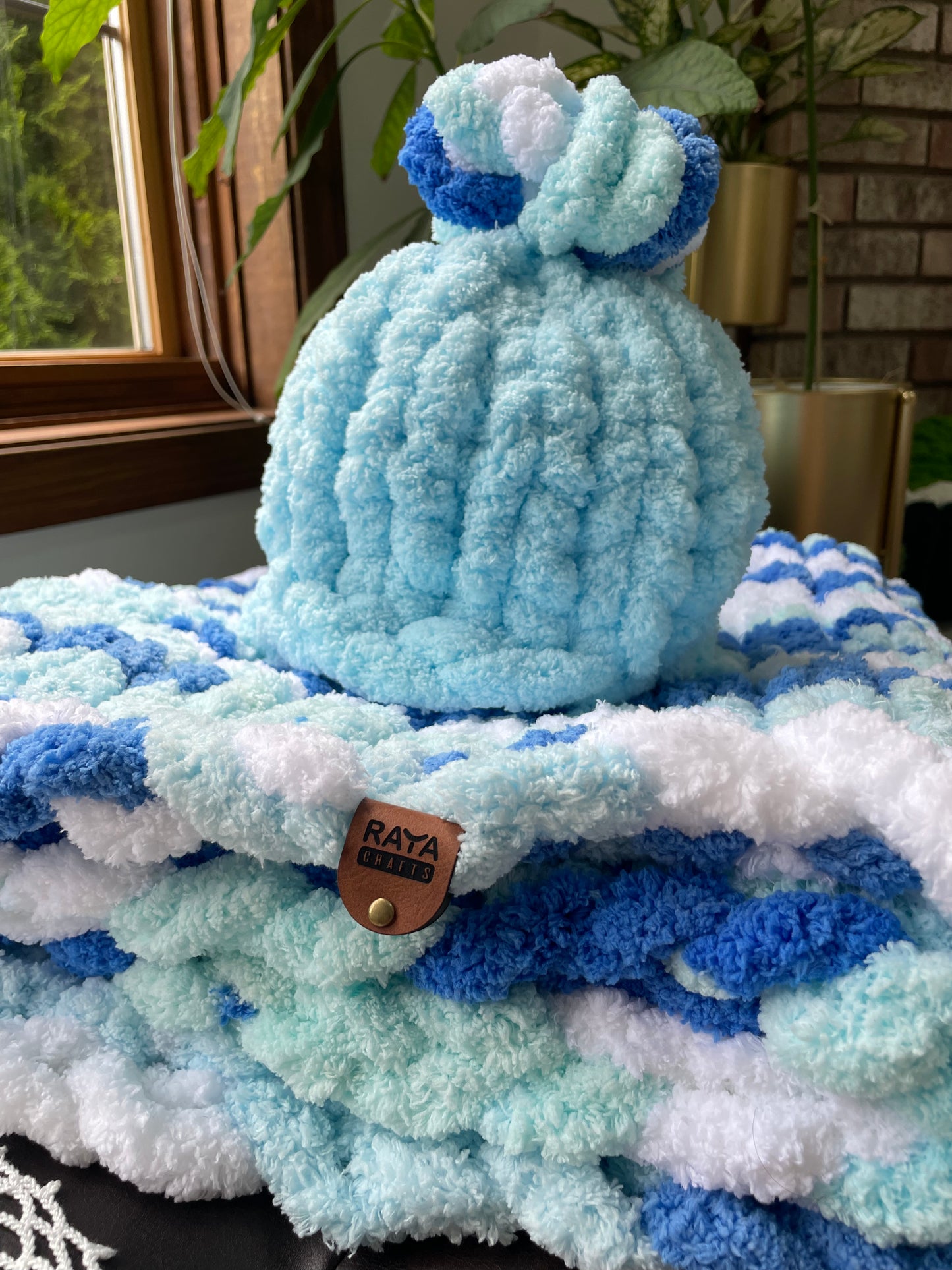 Handmade blanket made with love of 100% soft and cozy polyester chunky chenille yarn, a gift for a cute baby.